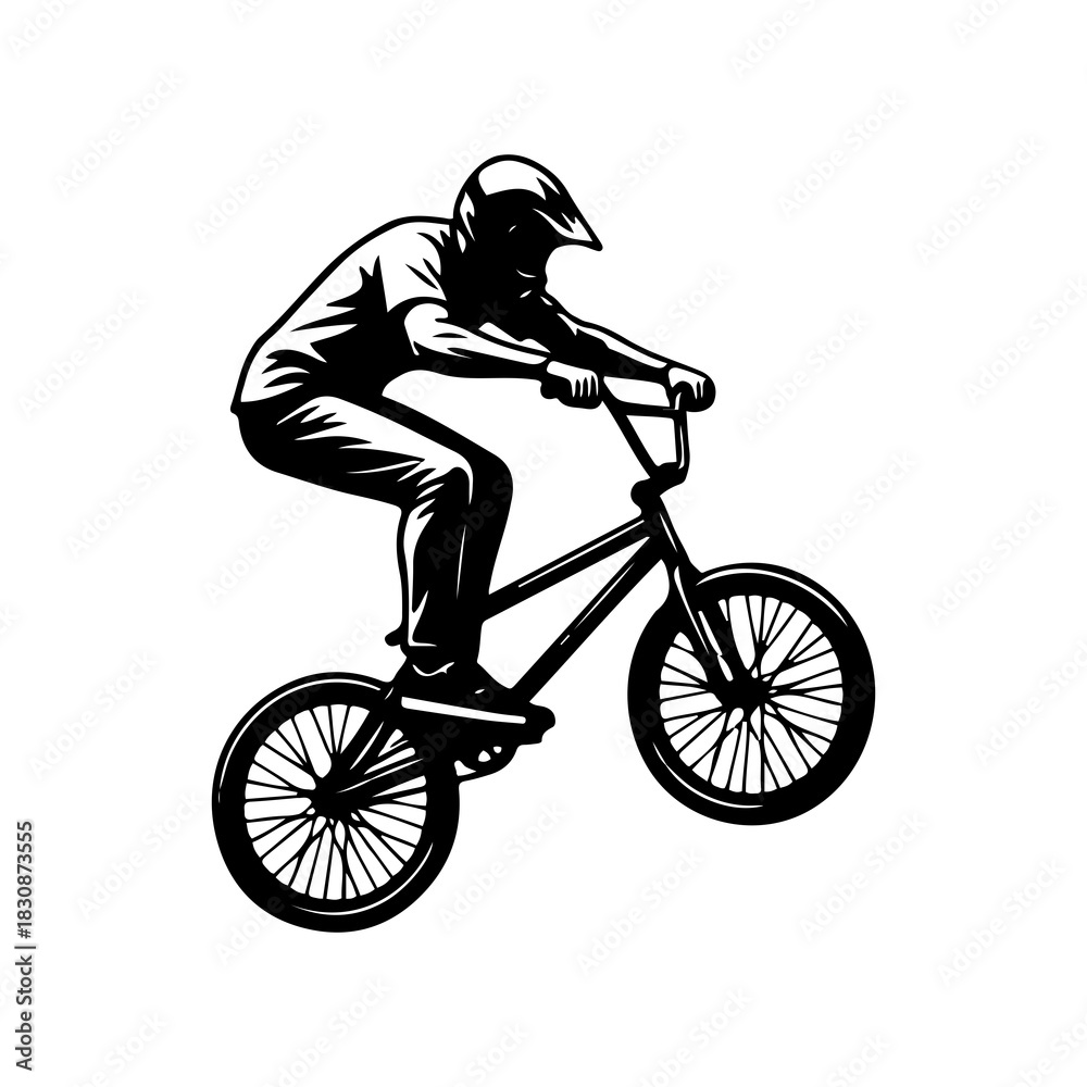 Fototapeta premium Silhouette of a bmx cyclist performing a high jump stunt.
