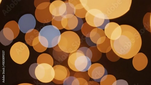 Abstract background with blurred golden lights creating a festive atmosphere and bokeh effect