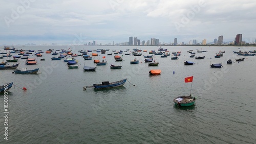 Asia Vietnam,Da Nang beach - The traditional round fishing boats of Vietnamese fishermen - a contrast between the ancient life of the fishermen and the modern skyline of Da Nang city