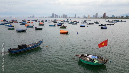 Asia Vietnam,Da Nang beach - The traditional round fishing boats of Vietnamese fishermen - a contrast between the ancient life of the fishermen and the modern skyline of Da Nang city
