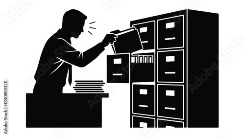Man searching for documents in a filing cabinet at work.
