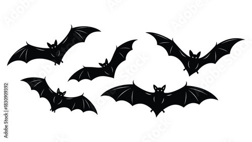 A spooky flock of five silhouetted bats flying in formation against a white background