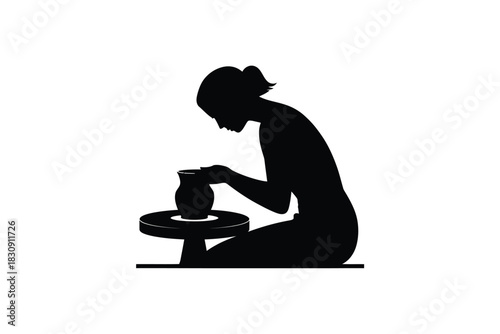 Silhouette of a woman shaping clay on a pottery wheel