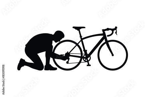Silhouette of a cyclist repairing a road bike on white background