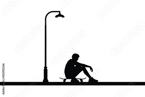 Silhouette of a skateboarder sitting under a streetlight on white