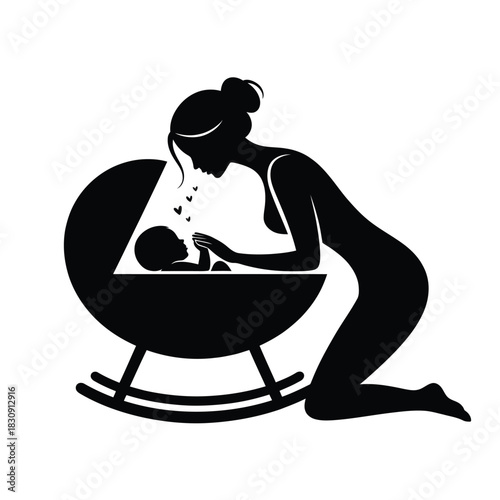 Silhouette of mother kneeling beside cradle with baby inside