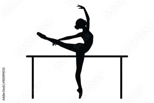 Elegant ballerina silhouette performing a stretch at the barre in studio