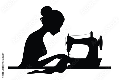 Silhouette of a woman sewing with a sewing machine