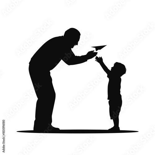 Father and son silhouette playing with a paper airplane together
