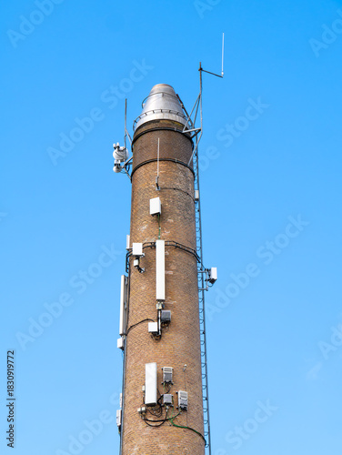 Telecom antennas mounted on brick chimney in Kerteminde, Denmark