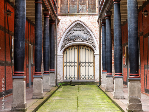 Cloister, covered walkway with columns, leading to Holy Spirit Church in Heilgeist Monastery in old town of Stralsund, Mecklenburg-Vorpommern, Germany