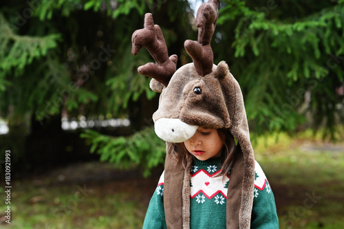 Toddler girl in deer hat