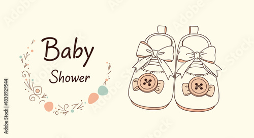 Cute baby shower invitation design with hand-drawn baby booties adorned with bows and buttons, surrounded by a delicate floral wreath.