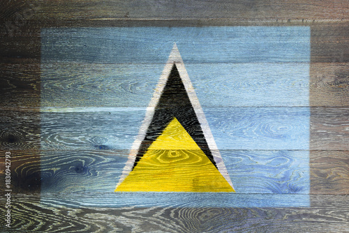 St. Lucia flag on rustic old wood surface background