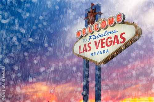 Welcome to Fabulous Las Vegas Sign During Rain With Storm. Logo Removed. The beautiful sunset sky cloudy with Rain and Storm