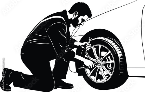 silhouette of a man changing the punchered tyre of his car