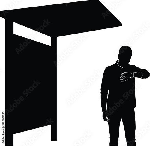 silhouette of a man in a suit standing under shade watching time from his watch