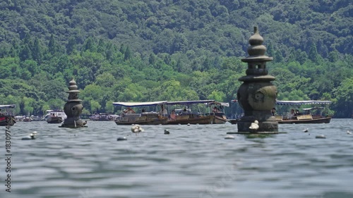 Three Pools Mirroring the Moon pagodas West Lake Hangzhou China traditional boats scenic landscape