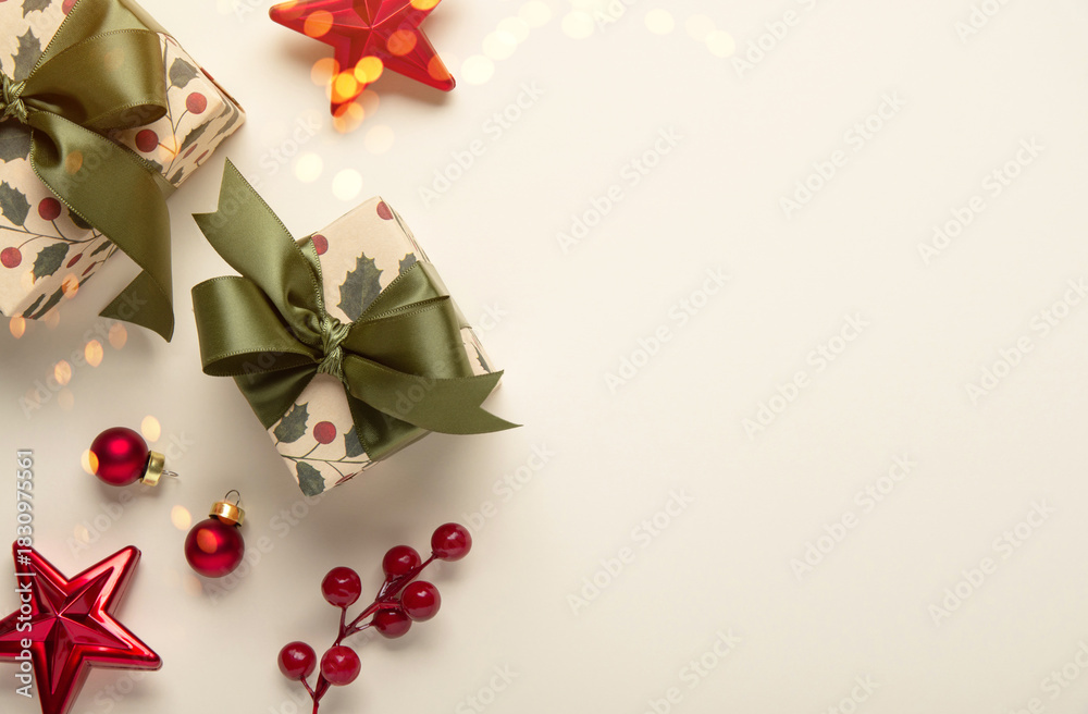 Fototapeta premium Merry Christmas and Happy Holidays greeting card, frame, banner, border. New Year. Christmas red ornaments and gifts, presents on light beige background top view. Winter xmas holiday festive theme.