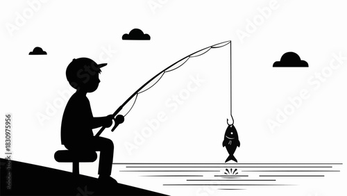 Silhouette of a young boy sitting and catching a fish.