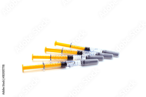 Pile of syringes isolated on white background. Self-injections anticoagulant therapy preventing blood 
clots. Prevention of Postpartum thrombophlebitis.
