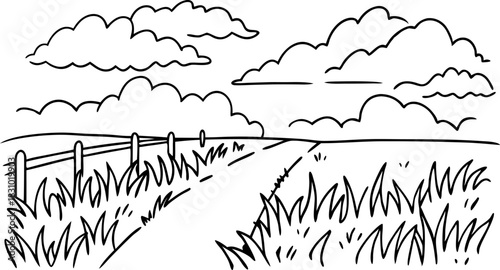 Rural country landscape with dirt road, fence, grass field and cloudy sky horizon