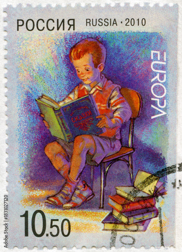 RUSSIA - 2010: shows boy reading book, Europa programme Children books, 2010