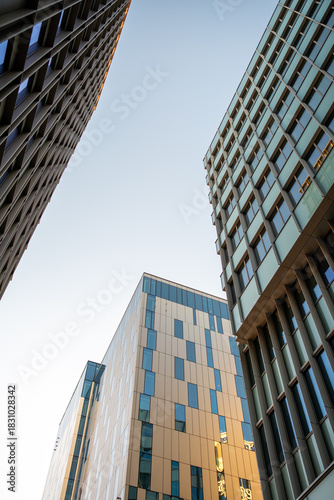 A facade shaped by reflection and perspective defines urban architecture in Hagastaden, elevating Stockholm buildings within a skyline driven by coherent contemporary design themes