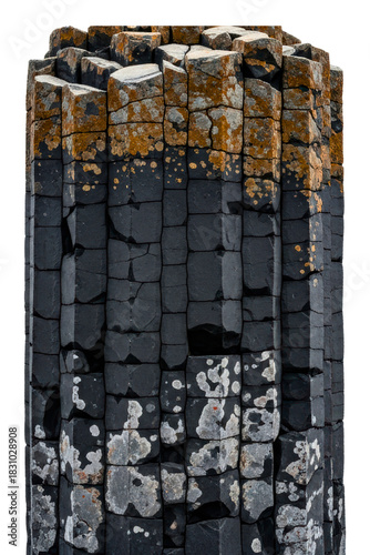 Vertical basalt columns with textured rock surface and lichen isolated on transparent background