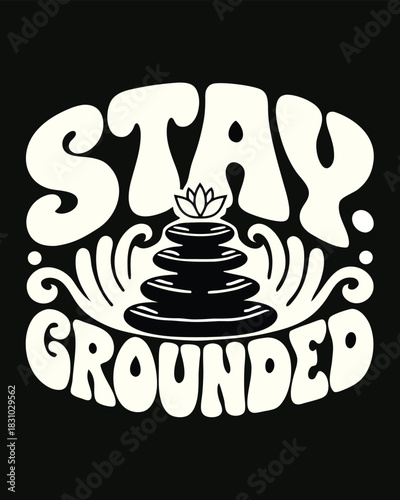 Stay Grounded is seen above stacked stones and a lotus flower on black background