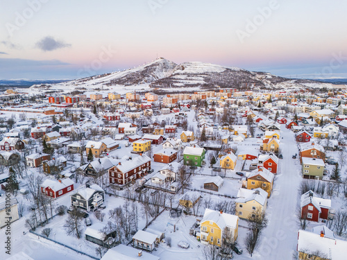 Vászonkép Kiruna, Sweden, colorful houses in a wintry landscape in the high arctic during