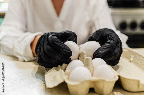 Chef in Black Gloves Handling White Eggs