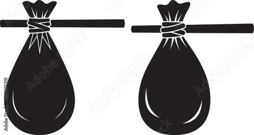 Two black silhouette bags hanging on a wooden stick