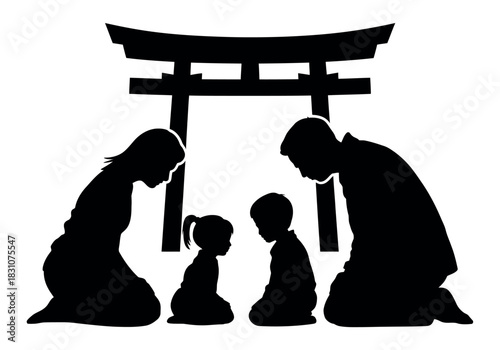 Silhouette of family praying before a torii gate in a respectful manner