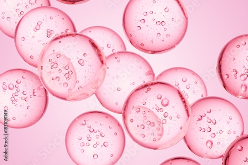 Pink translucent spheres with internal bubbles floating in liquid, ideal for beauty campaigns, cosmetic science visuals, and soft modern abstract design use