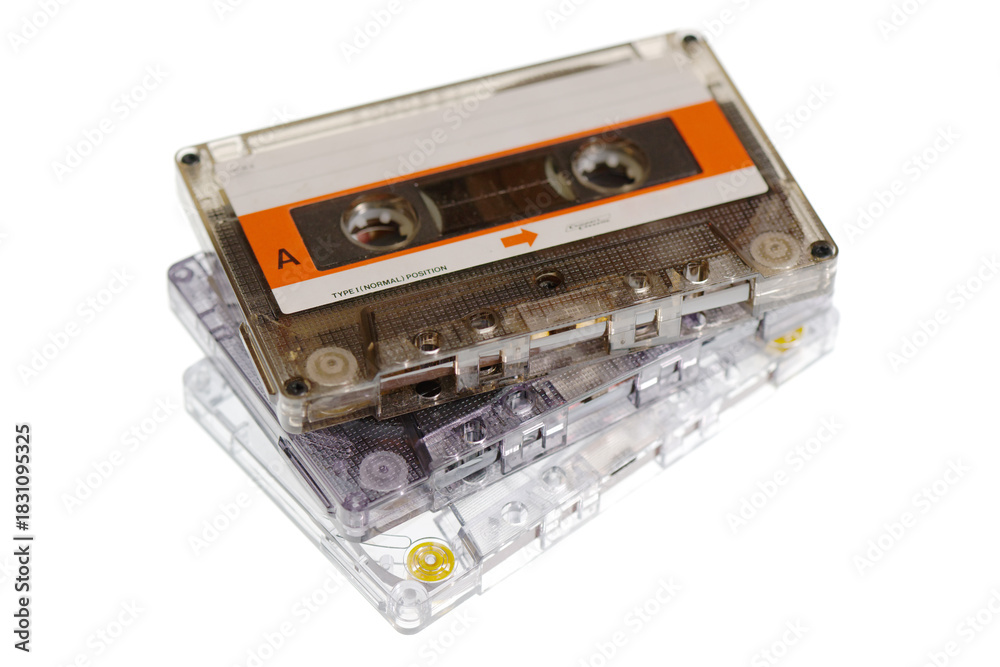 Obraz premium Stack of retro audio cassettes isolated on white background