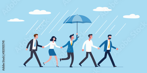 Team walking together under umbrella in the rain