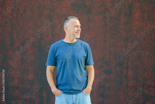 Mature man standing casually outdoors