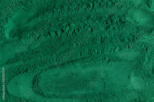 Spirulina powder with rich green texture background