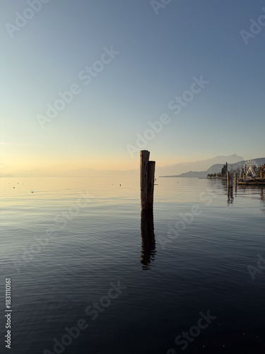Sunset light over Lake Garda peacful waters, Italy