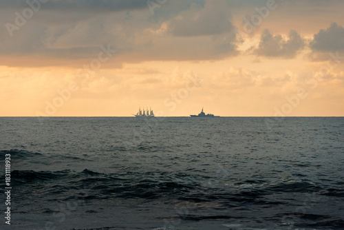 Sailing ship on cloudy Portizuelo beach horizon
