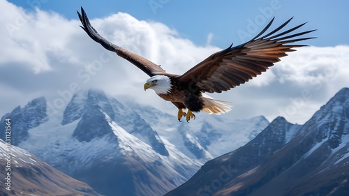 Bald eagle soars majestically across a mountainous landscape with a cloudy sky
