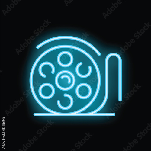 Neon blue film reel glowing on a black background