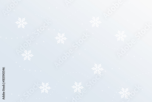 White snowflakes of varying sizes and blurs on a light gray-white background.
