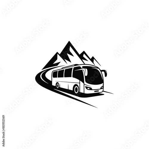 a sleek tour bus travels along a winding road with towering mountains in the background silhouette
