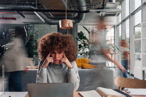 Photos Overwhelmed woman suffering headache in busy office