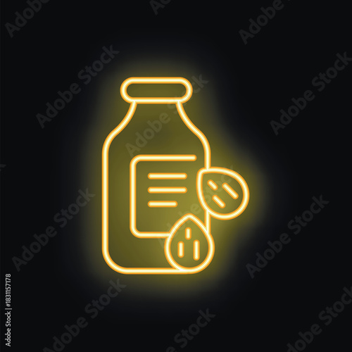 Yellow neon icon of almond milk in a glass bottle glowing on a black background