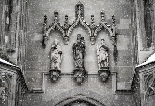 Gothic architecture detail of the medieval stone door sculpture at  “Müntzer unserer lieben Frau” (Church of Our Lady). Constance, Baden Württemberg, Germany.