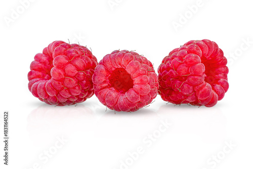 Three juicy red raspberries on a snow-white background.