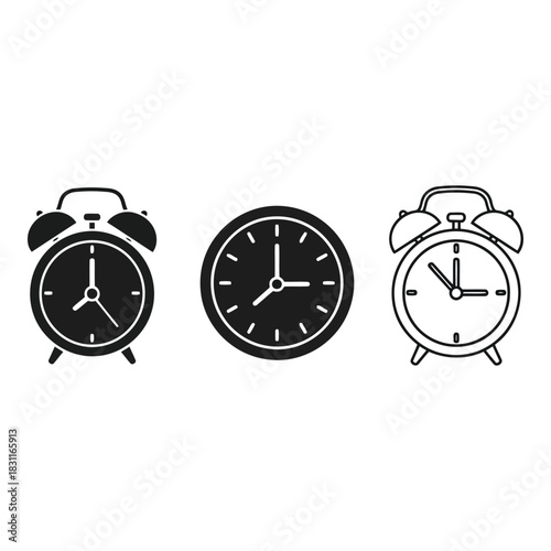 Collection of three alarm clocks and a round clock face
